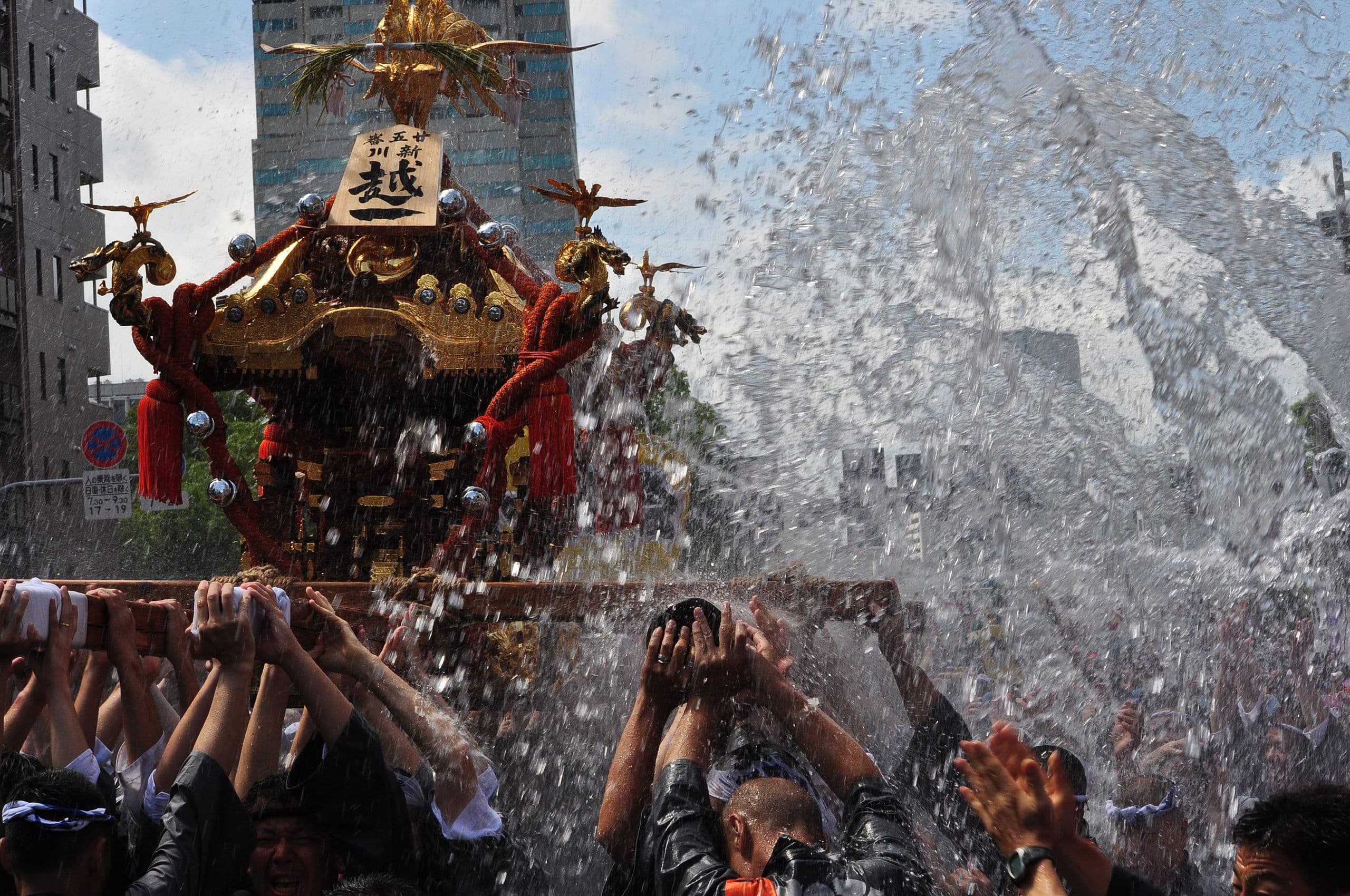 Mizukake Event and a Portable Shrine at the Fukagawa Festival